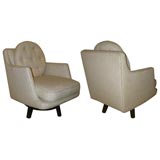 A Pair of Dunbar Upholstered Swivel Chairs.