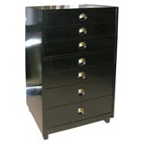 A Tall Black Lacquered Seven Drawer Chest on Chest.