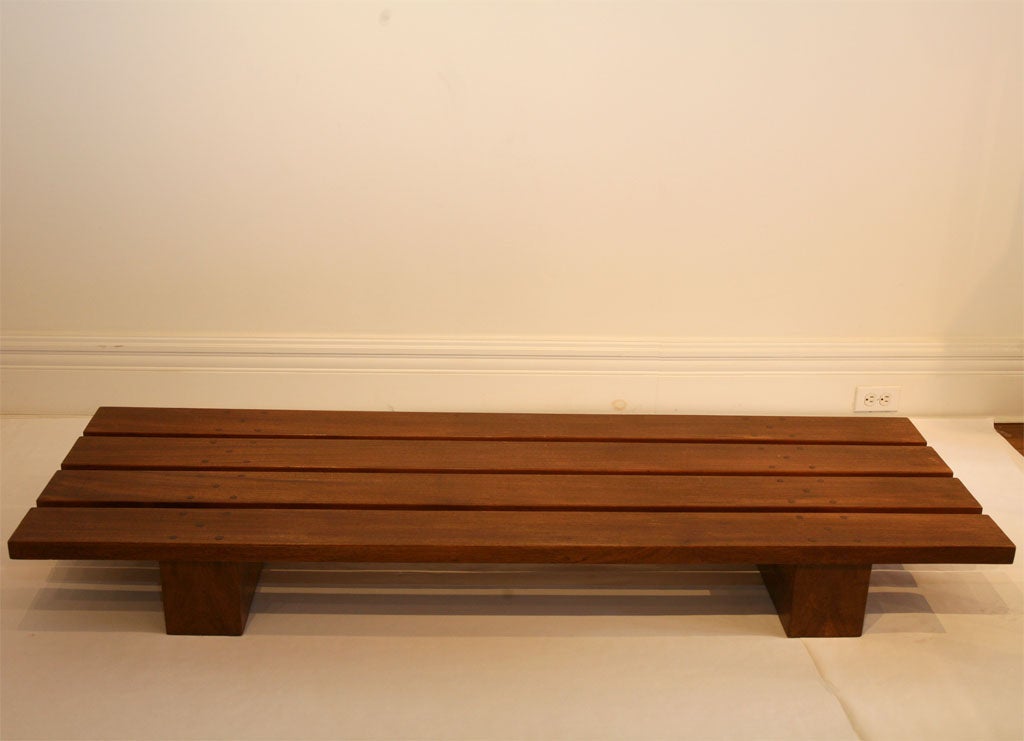 Solid mahogany low table / bench influenced by Charlotte Perriand's design.<br />
Stamped on both legs : 