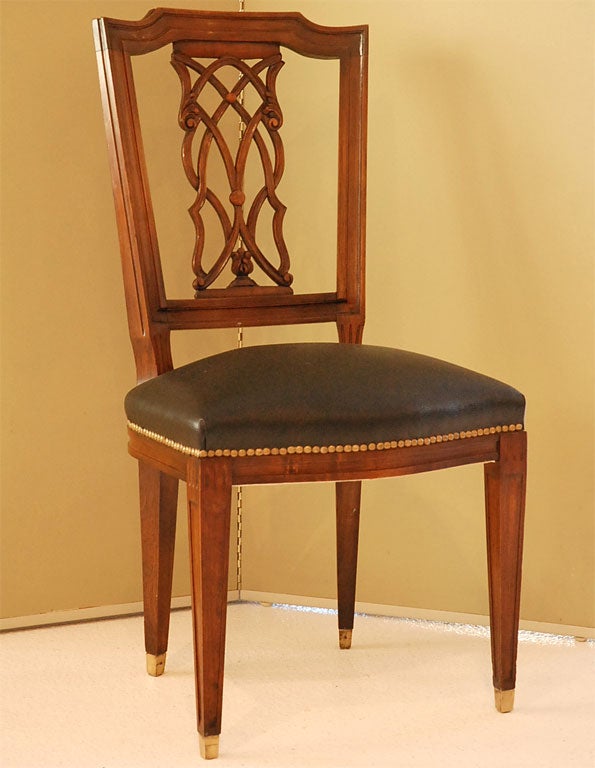 Gorgeous set of six dining chairs with hand carved lattice-back detail.   The finish is all original and the brass sabots are all present and accounted for.  

The chairs are clearly marked with the Jansen identification (see detail shot).