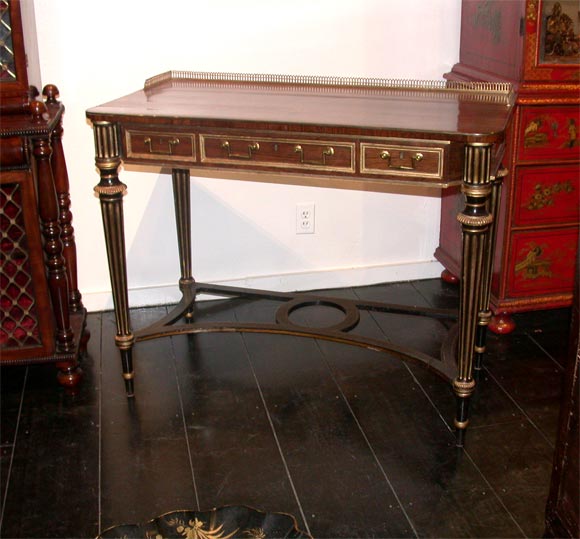 A George III Rosewood Table with Brass Gallery