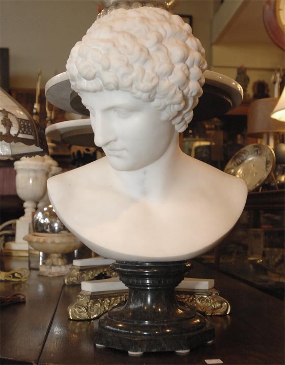 Carrara marble portrait bust of Antinous by Pietro Bazzanti signed and dated 1882.  Some would consider this to be a version of Praxiteles's Hermes from the 3rd century B.C. This is an extraordinarily well carved classical style life-size bust. The