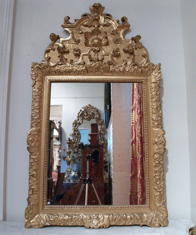 Period Regence gilt wood mirror  with carved and gilt wood.