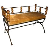 Black iron bench with wooden balls