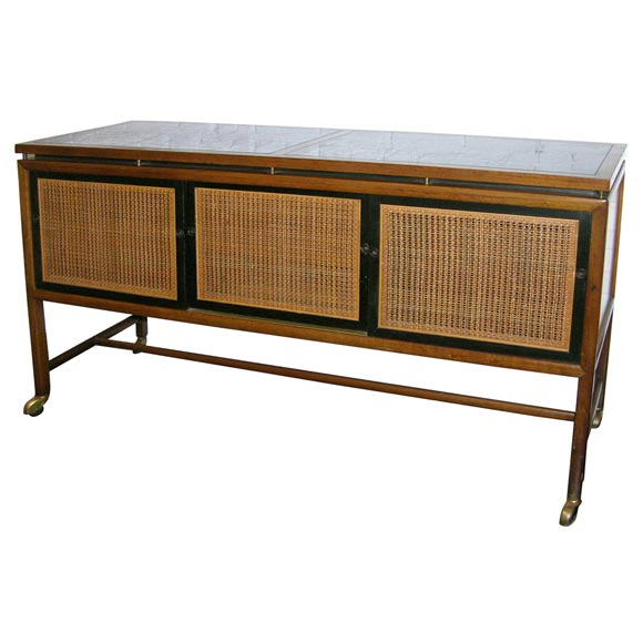 Console/ buffet  with sliding cane doors by Michael Taylor