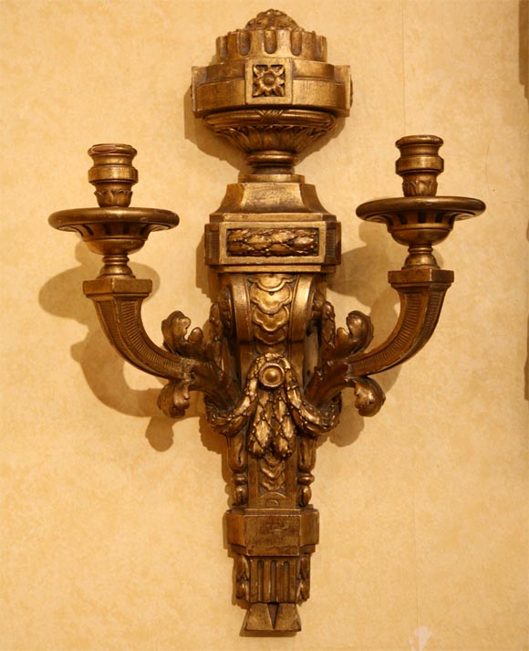 Richly carved and gilded 18th century sconces.
