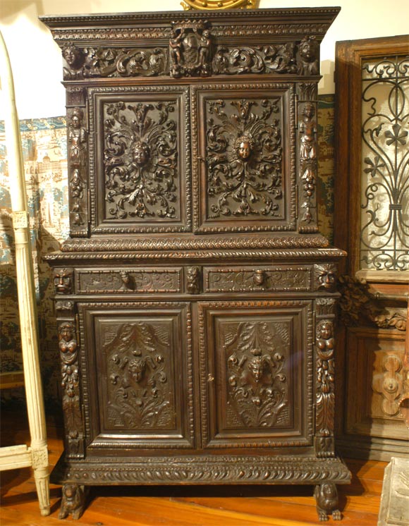 Late 16th c. early 17th c. ITALIAN Carved step back cupboard. Wonderful crest and unusual sphinx like feet.The carving is a work of art it is sharp and extremely back carved,EXCEPTIONAL.