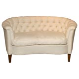 Antique tufted kidney shaped settee