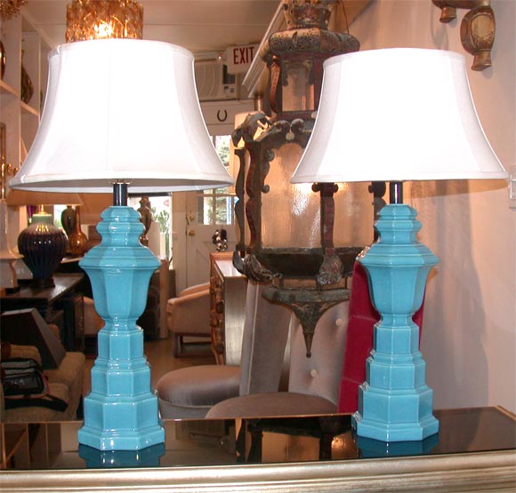 PAIR OF UNUSUAL CERAMIC LAMPS WITH A PEACOCK BLUE GLAZE.