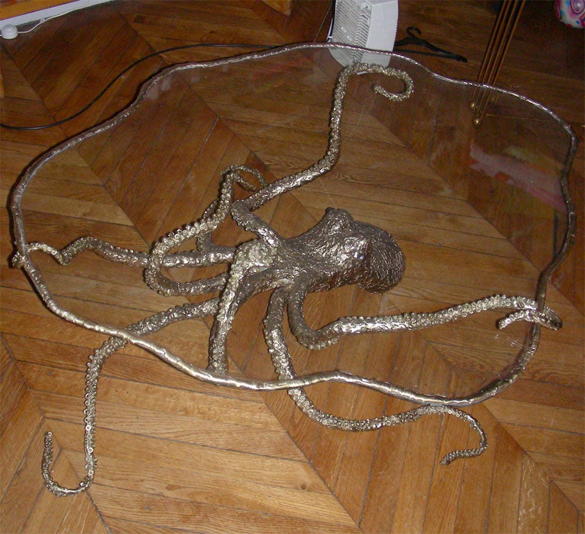 1970s coffee table with an octopus-shaped bronze base and top surface in glass.