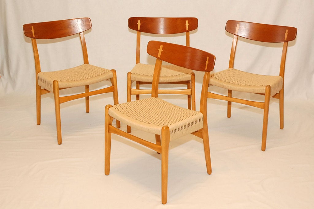Set of 4 Hans Wegner CH-23 dining chairs designed in 1951 and produced by Carl Hansen & Son. Note: We have larger sets. Store formerly known as ARTFUL DODGER INC