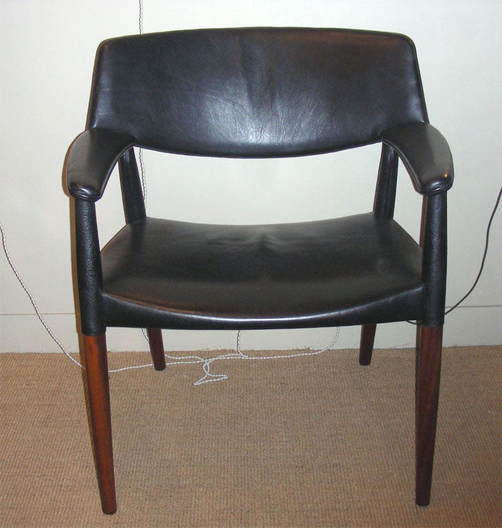Two 1950s mahogany armchairs upholstered in leather, by Ejner Larsen and Axel Bender-Madsen, edited by Willy Beck.