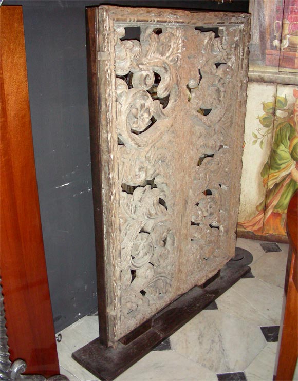 1500  interior shutter from a Florentine palace in carved walnut, set in metal and bronze.