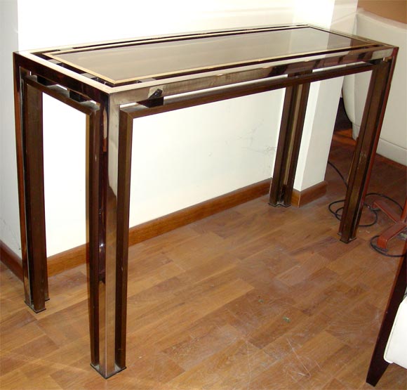 1970s console table in metal, steel, bronze and smoked glass top.