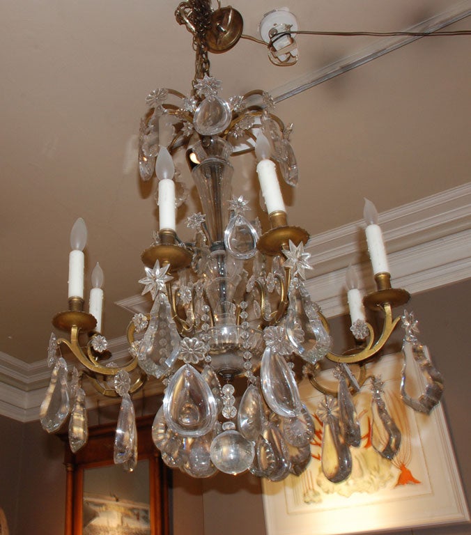 Exceptional period French eight light gilt bronze chandelier having very large thick crystals.  These large, thick crystals were used in the 18th and beginning of the 19th centuries.  It has been newly wired.