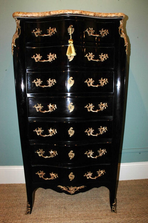 French black-lacquered semainier with gold fossil marble top, and gilt-bronze pulls and mounts, working locks with keys