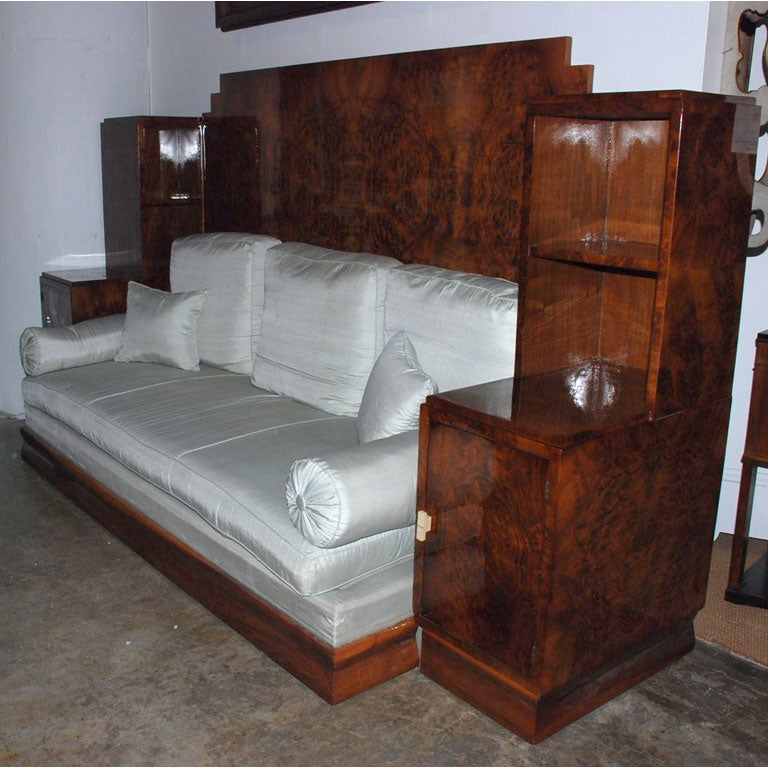 Fantastic Art Deco veneered mahogany daybed with built-in cabinets. Original Ivory pulls.