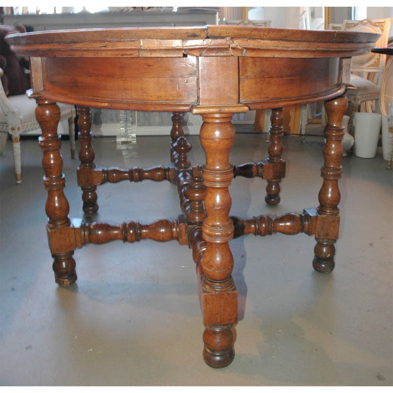 18th century fruitwood oval centre table. With turned legs and stretchers. Original finish.