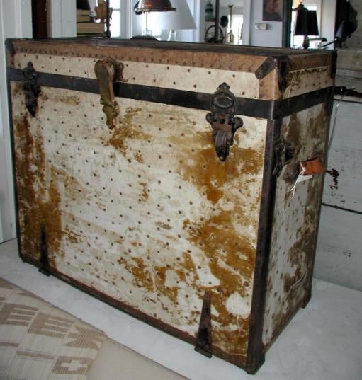Beautifully patinated studded leather officer's campaign desk from the Civil War. The writing surface is painted canvas. The top opens to a canvas covered storage shelf. The depth open is 35