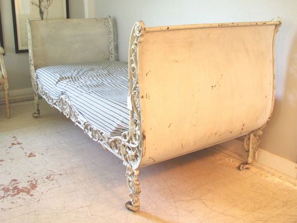 Exquisitly detailed French iron campaign bed with original white paint.