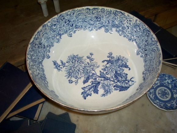 Striking blue and white transferware punch bowl in excellent condition. No cracks, chips or discolorations. Some wear showing on gold top rim.