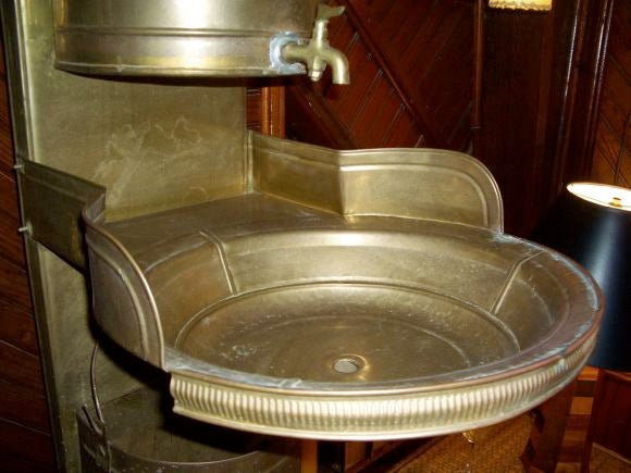 Brass sink from a train. Would make an amazing powder room sink if plumbed. There is fairly heavy age patina which could be polished up.