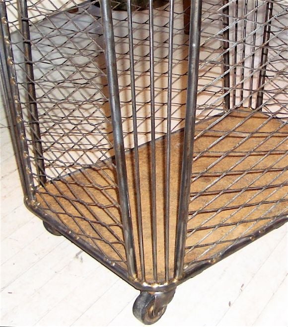 Polished steel industrial or laundry cart with composition wood bottom