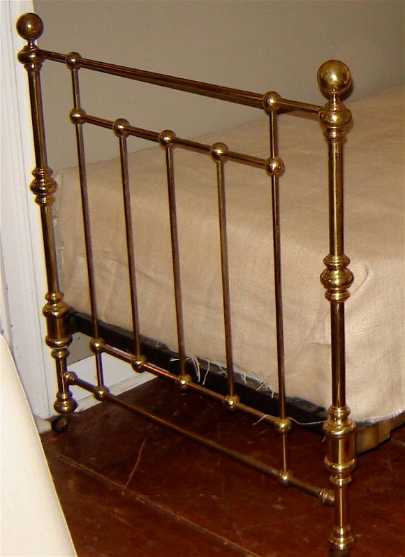 Handsome pair of twin size brass beds with some age patina on brass. Will fit a twin mattress.