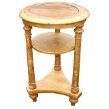 Round two tier side table on tripodal base.