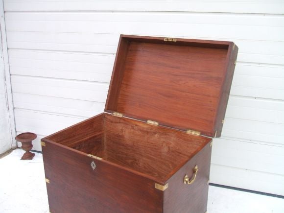 Campaign Chest with Brass Trim support and handles. Four Bun Feet.