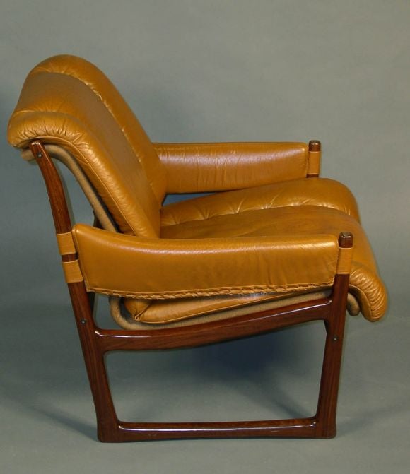 A pair of armchairs covered in original leather and executed in rosewood, Nesjestranda Møbelfabrik, Norway, circa 1960. Labelled.