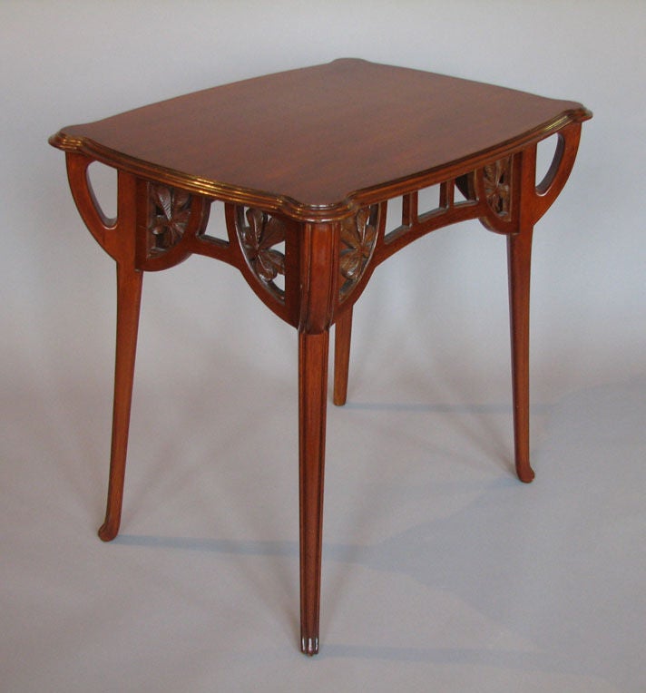 An Art Nouveau period side table executed in mahogany, the design attributed to Abel Landry, 1871-1923. France, circa 1905.