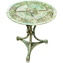 A Napoleon III period cast iron, tripodal garden table