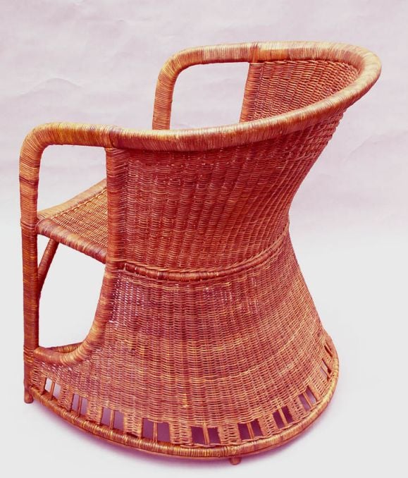 An English Arts and Crafts period wicker tub chair designed by Harry Peach for Dryad. This model, identified as by Dryad, appears in an illustration accompanying an article discussing the work of Harry Peach. Copy available. Ca. 1905.