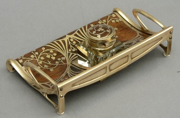 A Secessionist period inkwell by Erhard and Son executed in plaisander inlaid with brass motifs. Austria, ca. 1905