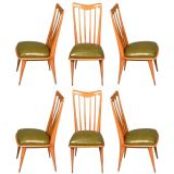 A set of six open back dining chairs