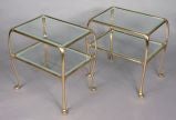 Pair of two tier brass and glass side tables