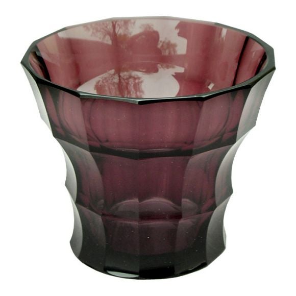 A faceted glass vase