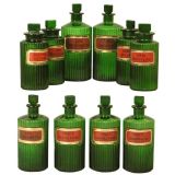 A set of ten emerald green glass pharmacy jars
