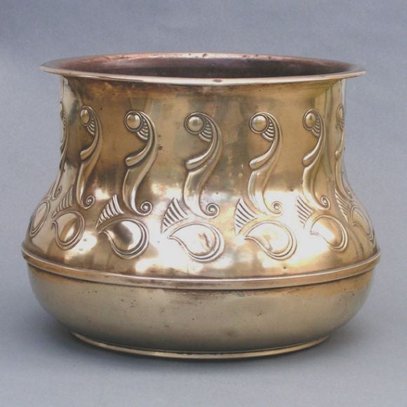A large Art Deco period brass cache pot having repousse decoration. Made by the KDM Company, Daalderop. Marked.