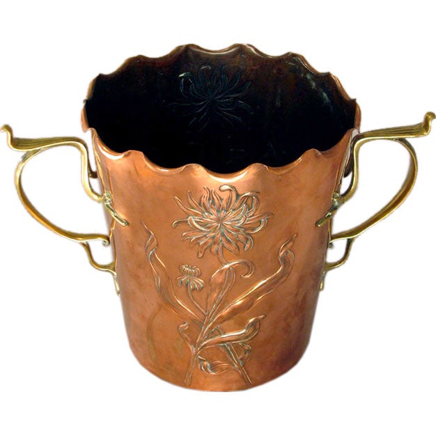 A Jugendstil jardinière executed in brass and copper by Carl Deffner. Marked.