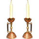 A pair of English Aesthetic period candlesticks