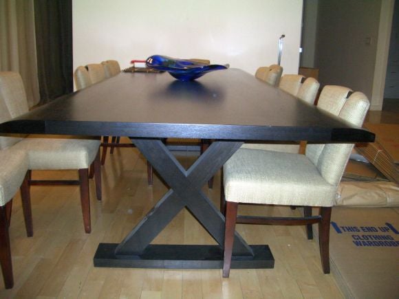 Beautiful Christian Liagre dark stained American walnut x leg dining table. Seats ten easily.Color is very dark, almost black.