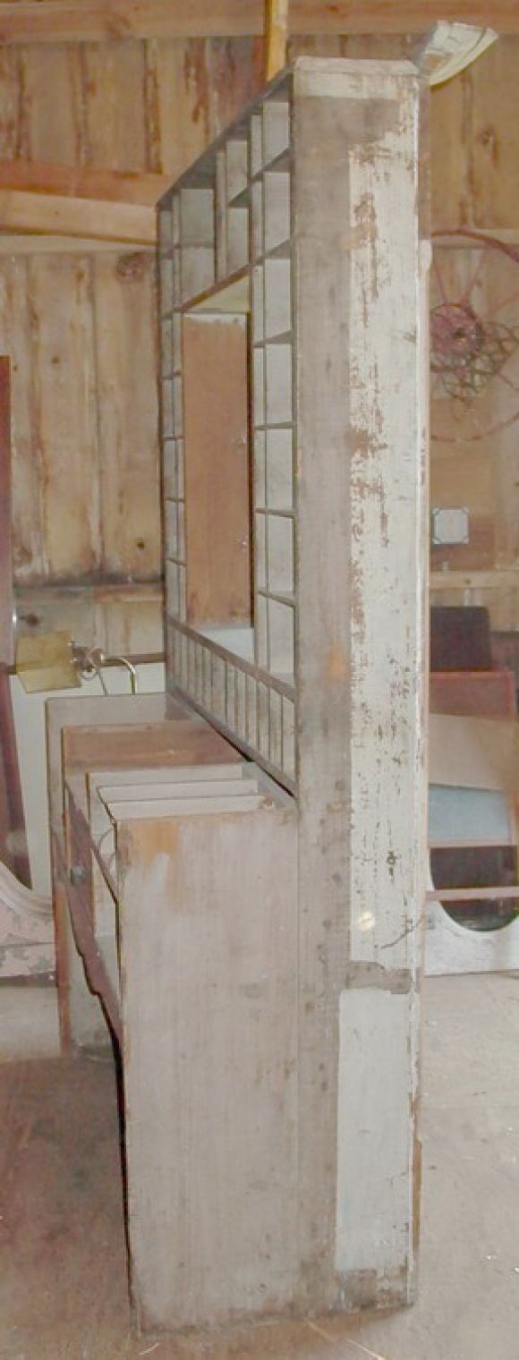 A true old Life Size Post Office Counter with slots and drawer, Window Screen Opens, Great Architectural Piece. Shown installed in image 10