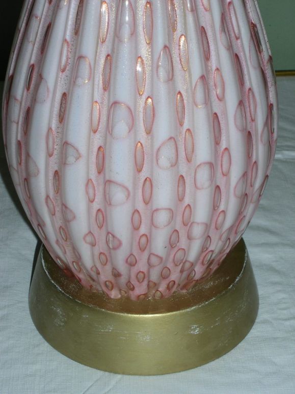 Large ribbed Murano lamp, pink and white glass with gold fleck. Gilt wood base.