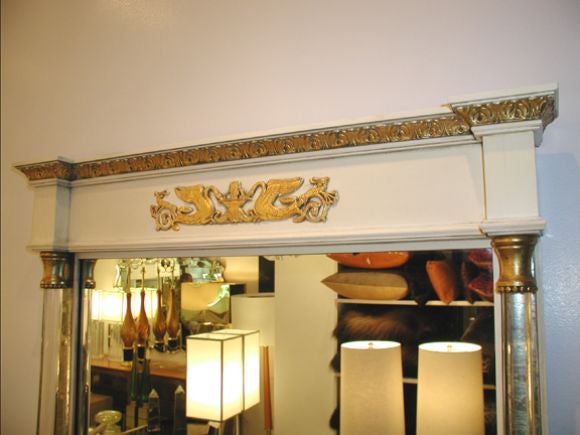 Grosfeld House mirror with Lucite columns and gold leaf detailing.

In stock.