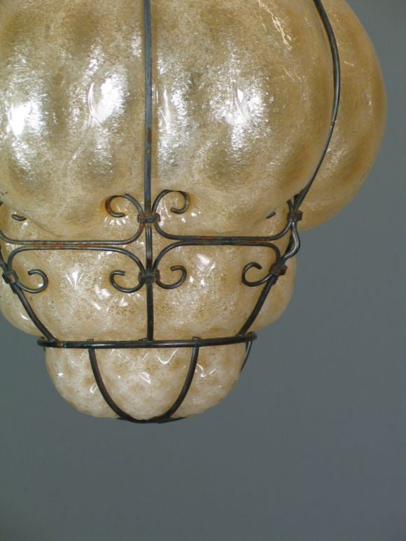 Italian Murano glass blown into metal frame