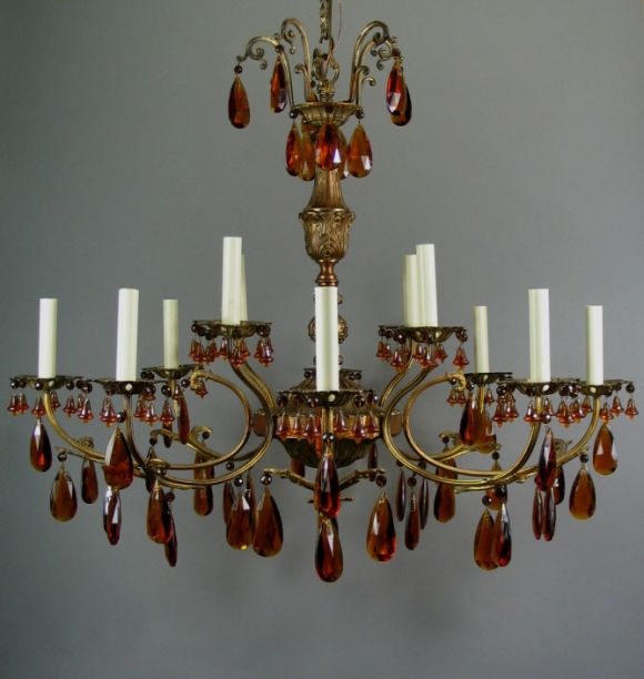 Circa 1940's  Large 12 lite amber crystal and brass chandelier