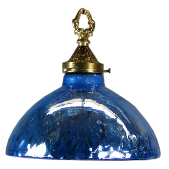 Circa 1920  quilted blue mercury glass pendant