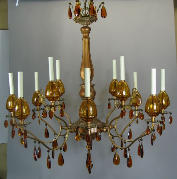 Large twelve-light chandelier with amber glass cups and crystal. On sale regular price $4800 now $2175. No additional discounts.